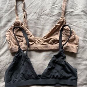 SKIMS Soft Triangle Bralettes in Black & Nude